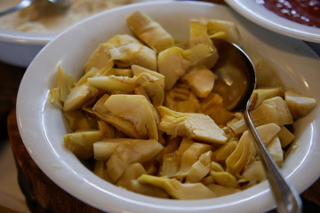 Canned artichoke on a plate close-up shot,  food at a high category hotel, all inclusive menu