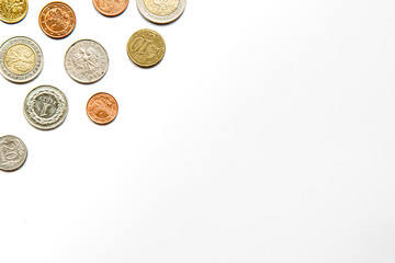 White background with coins in the corner
