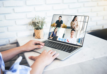 Woman video conference with team on laptop,have online briefing or consultation from home,Business team using laptop for speak talk on group in video call. Group of people working from home.
 - obrazy, fototapety, plakaty