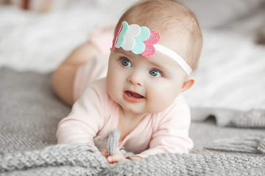 Adorable cute child. Little baby close up picture. Happy baby girl.