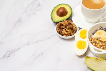 breakfast of coffee, smoothie bowl, fruits and nuts and a place for text
