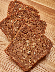 sliced black cereal bread on the table