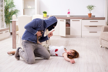 Gangster and young woman in robbery concept