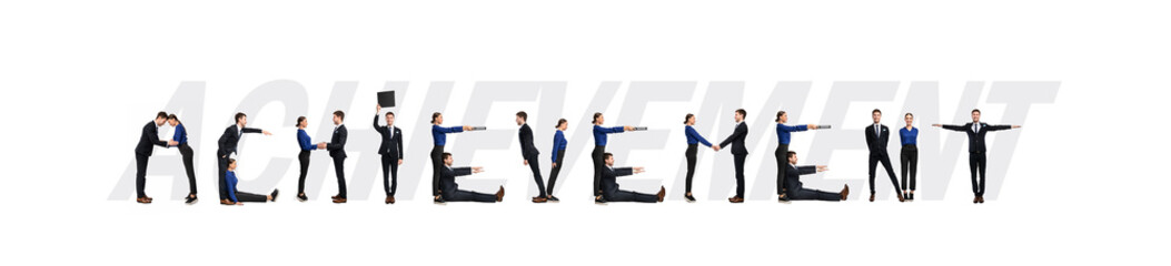 Group of people forming achievement word at studio