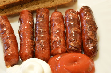 fried sausages with ketchup bread and mayonnaise