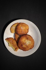 Homemade Semolina Cookies with Sugar in a Plate Isolated on Black Background in Vertical Orientation