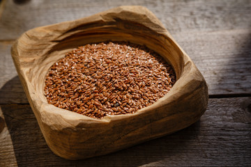 flax seeds in a wooden bowl