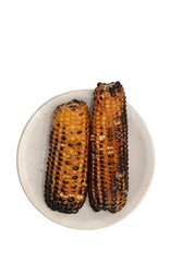 Top View of Roasted Corn or Maize in a Plate Isolated on White Background in Vertical Orientation