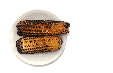 Top View of Roasted Corn or Maize in a Plate Isolated on White Background with Copy Space for Texts Writing