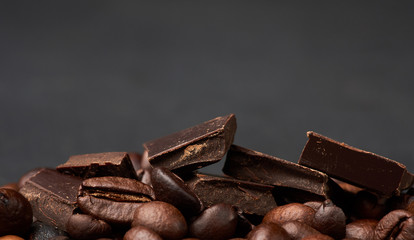 pieces of dark chocolate and roasted brown grains of Robusta coffee