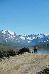 People jogging in the beautiful Tasermiut fjord in Greenland