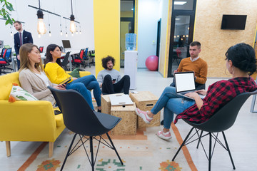 Multiracial young creative people in modern office. Group of young business people are working...
