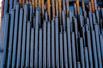 Obraz premium Construction of Oil and Gas Pipeline, horizontal directional drilling. Drilling of oil and gas wells. In the foreground, a threaded joint of pipes