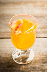 Healthy hot beverage with oranges, apples and spices for protection in flu season. Selective focus. Shallow depth of field.