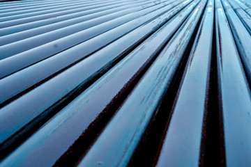 Texture oil drill pipe. Rusty drill pipes were drilled in the well section. Downhole drilling rig.  View of the shell of drill pipes laid in courtyard of the oil and gas warehouse
