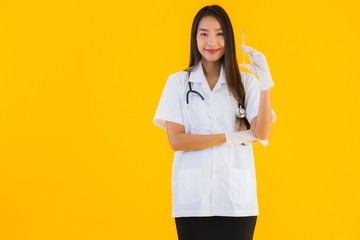 Portrait beautiful young asian doctor woman wear glove use syringe