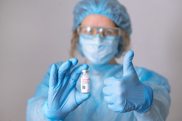 Coronavirus vaccine. Doctor with a vaccine. Nurse holding a coronavirus vaccine. Hands holding a...