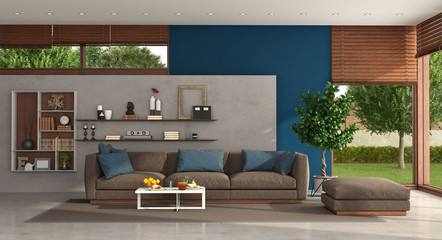 Living room of a modern villa with sofa nad footstool - 346157538