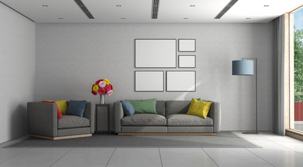 Minimalist living room with gray sofa and armchair