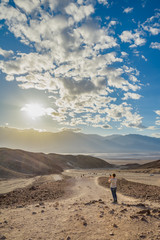 An unidentfied woman takes a photo with a cell phone in Death Valley National Park