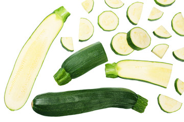 fresh green zucchini with slices isolated on white background. top view