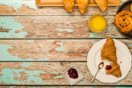 Continental Breakfast With Croissants on Rustic Table Overhead Flatlay