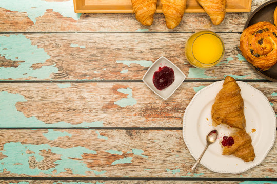 Continental Breakfast With Croissants on Rustic Table Overhead Flatlay