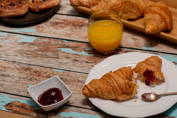 Continental Breakfast With Croissants on Rustic Table