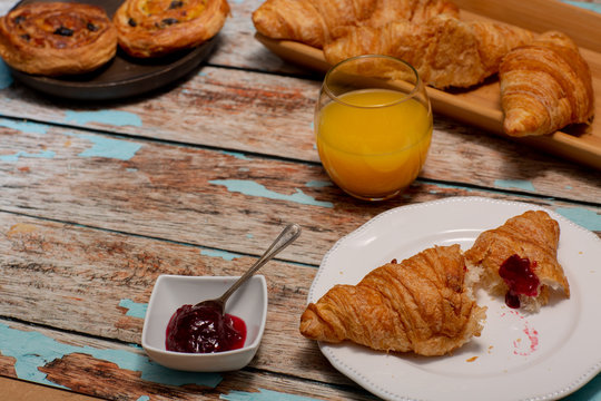 Continental Breakfast With Croissants on Rustic Table