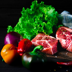 Food set for a picnic. Juicy meat steak and vegetables