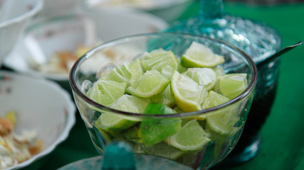 slice of lime fruits in a bowl