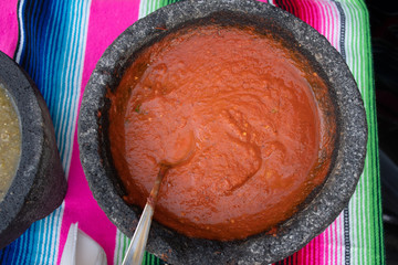 Spiced red tomato salsa and spiced green salsa for seasoning traditional Mexican food