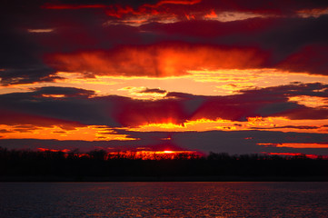 Red orange sunset over the lake.