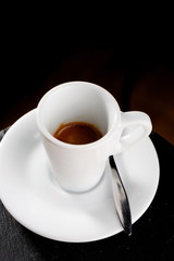 Cup of espresso coffee on the table