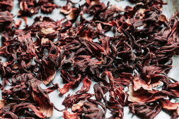 Red Hibiscus tea on the rustic background. Selective focus. Shallow depth of field.