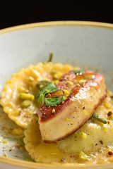 Fine dining Ravioli with Foie Gras and Pistacchios © Visionsi