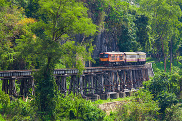 Vintage locomotive passes Death railway in Kanchanaburi, Thailand