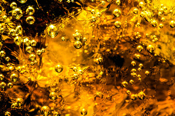 Background of cola with ice and bubbles. Side view background of refreshing cola flavored soda with carbonated with vintage tone 
