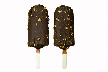 Ice cream covered with chocolate and almonds (clipping path),Chocolate-coated blocks of ice cream on stick