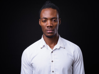 Obraz premium Face of young handsome African businessman with dreadlocks