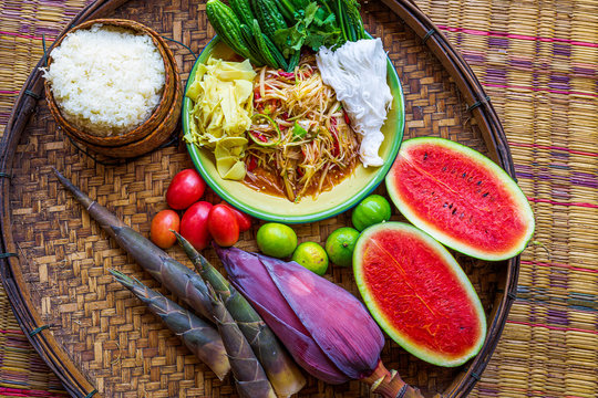 Search by image
Som Tam Tai, a popular and favourite Thai food dish made of young sliced papaya, chili, tomatoes, palm sugar and dried shrimp with sticky rice, 