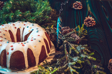 Christmas composition: a large festive cupcake decorated with white icing and pastry topping, a...