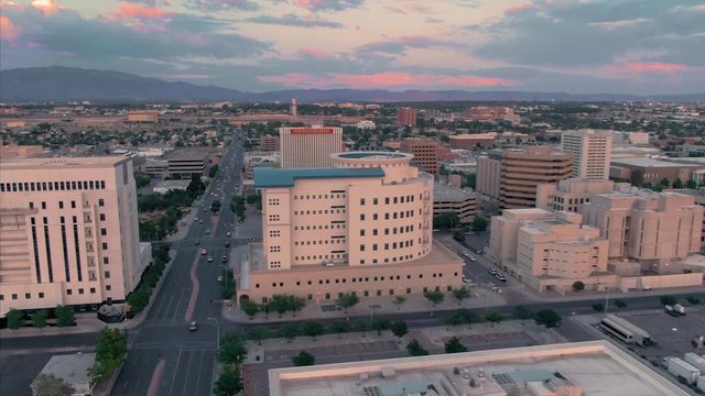 Albuquerque, New Mexico, USA. Aerial flying over the downtown city CBD at sunset