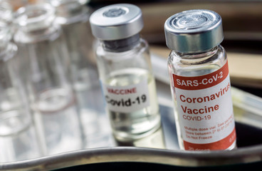 Coronavirus covid-19 experimental vaccine in a laboratory, conceptual image