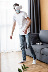 Selective focus of man in medical mask using vr headset at home
