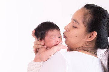 Asian newborn baby crying, hungry, sick on mother arm, Asian beautiful young mother hold infant worry her baby sickness, motherhood multi tasking at home