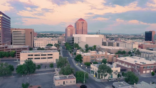 Albuquerque, New Mexico, USA. Aerial flying over the downtown city CBD at sunset