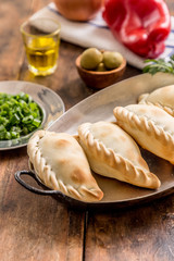 making empanadas bell peppers onion olives