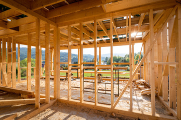 Fototapeta na wymiar Interior frame of new wooden house under construction