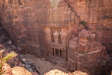 The Petra's Treasury and canyon from above with lot of tourist